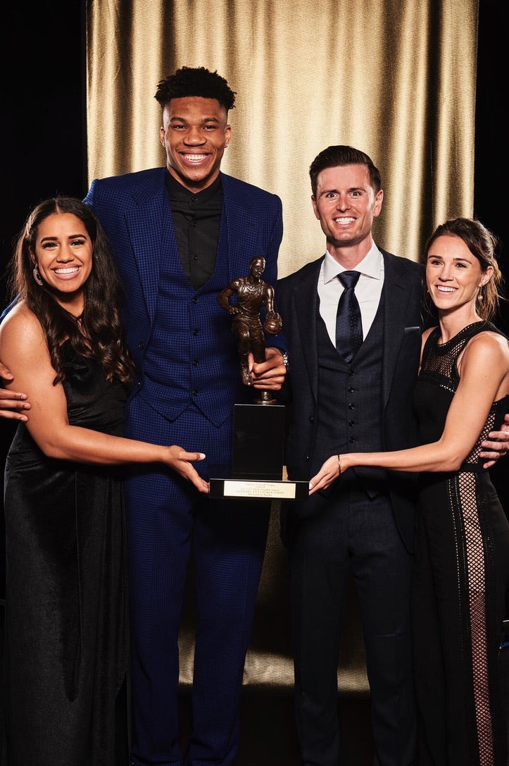 Brian and Ellen Davison with Giannis Antetokounmpo and Mariah Riddlesprigger celebrating Giannis's first NBA MVP from the 2018-2019 season. 